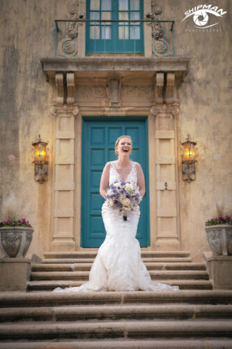 happy bride on the steps of Dresser Mansion in Tulsa