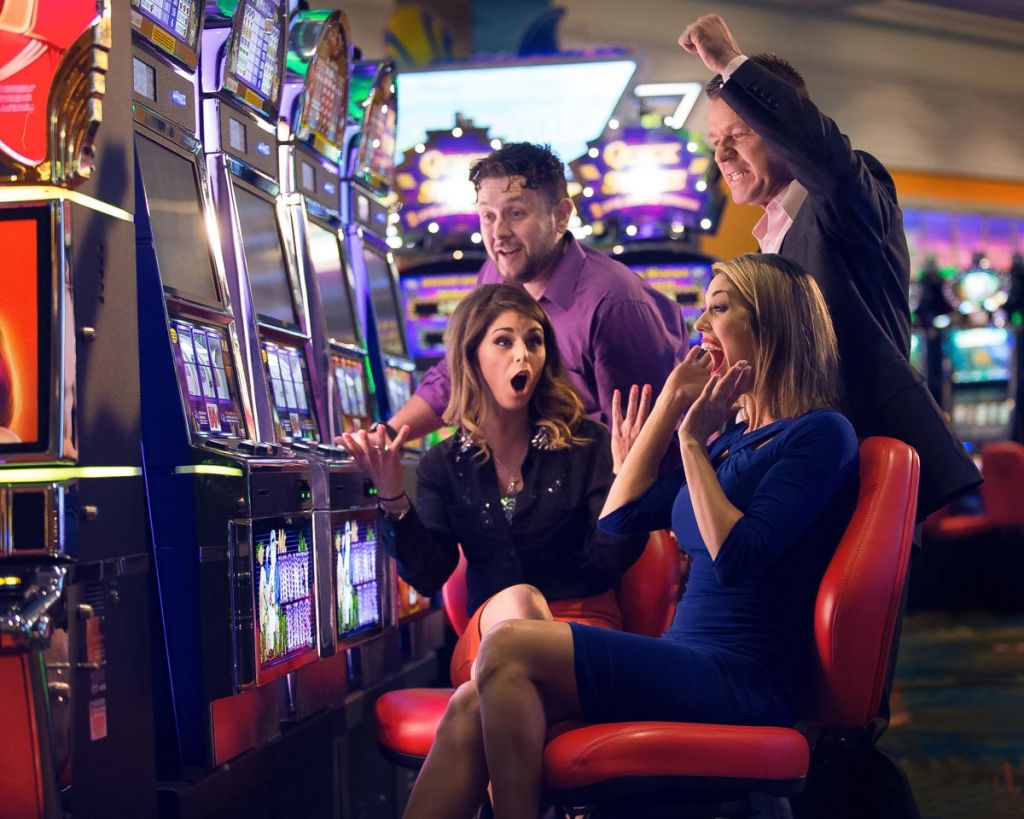 Excited woman wins a jackpot on a billboard image for River Sprit Casino in Tulsa.