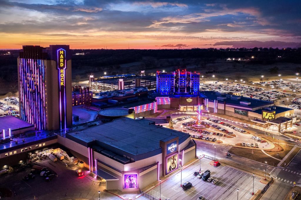 drone shot at sunset of hard rock tulsa hotel and casino