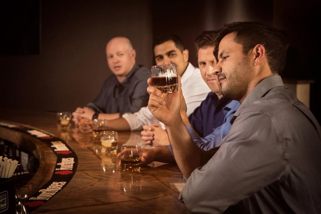 men enjoying bar drinks at hard rock tulsa beverage commercial photography