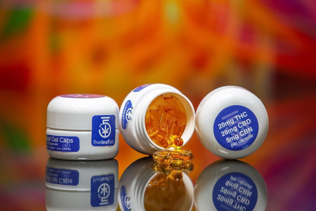 product photography of gel caps on reflective surface