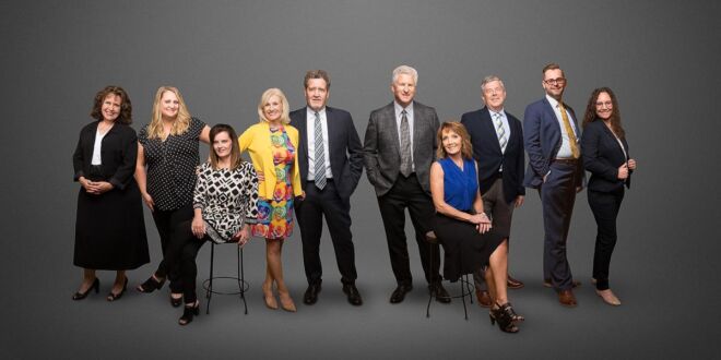team composite of corporate group corowrkers standing and sitting in various casual poses on a grey background