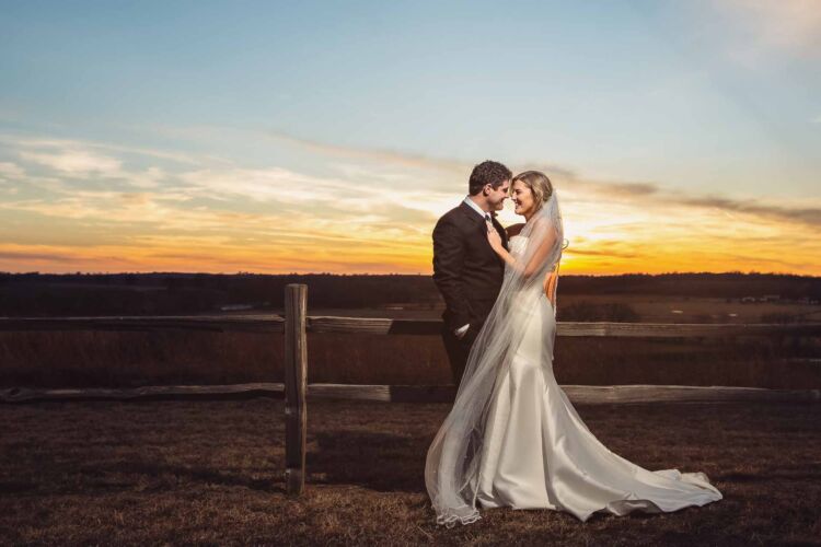 Bride and Groom on a ranch at sunset