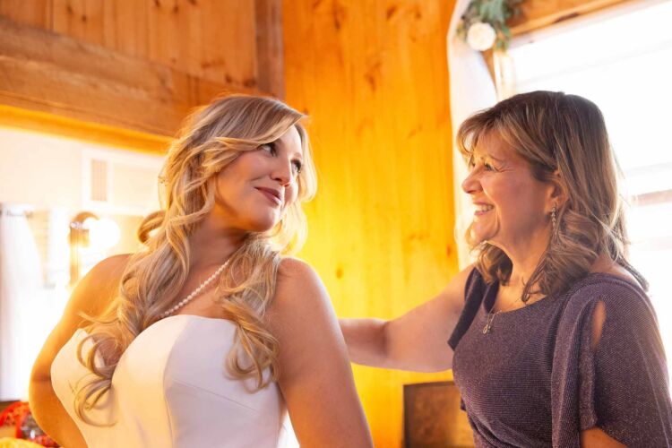 bride and her mother getting ready for the wedding