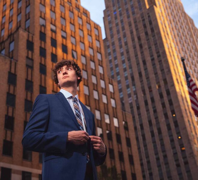 young man in a suit downtown