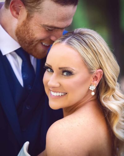 Beautiful smiling blonde bride with her groom, just married in Tulsa