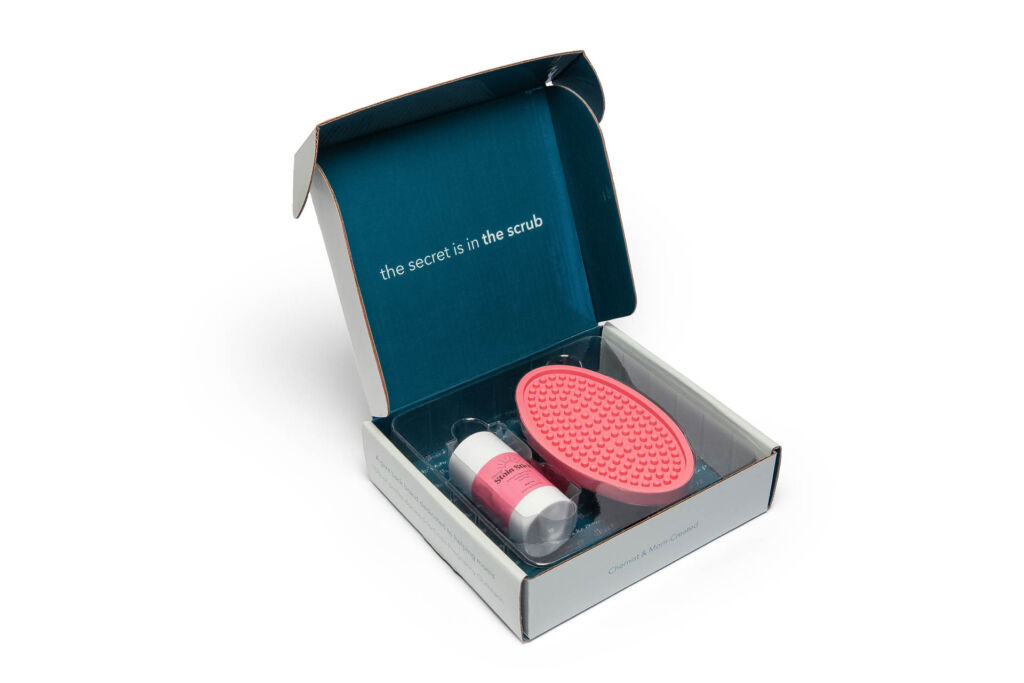 product photography in tulsa of a stain removing product and it's custom packaging on a seamless white surface