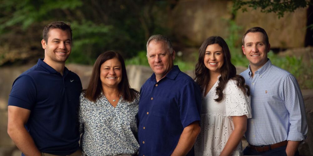 Family posing together at Tulsa's Centennial Park