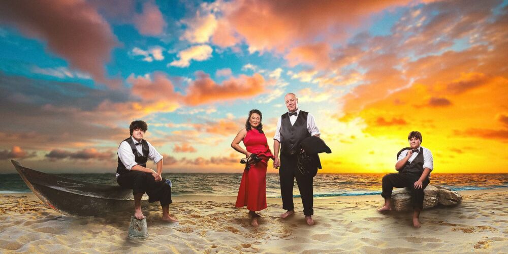 Family portrait on the beach at sunset
