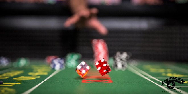 commercial photo of dice at a gaming table