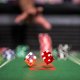 commercial photo of dice at a gaming table