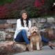 pretty girl with her dog in a park
