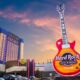 low level drone shot of big guitar and hard rock tower in Tulsa commercial drone photography casino
