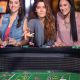 attractive women throwing dice at a casino gaming table in Tulsa. girls night out.