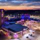 drone shot at sunset of hard rock tulsa hotel and casino