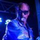 Snoop Dog blowing a smoke ring live in a concert photo in Tulsa