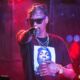 Snoop dog pointing at the camera during a live concert. concert photography