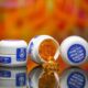 product photography of gel caps on reflective surface