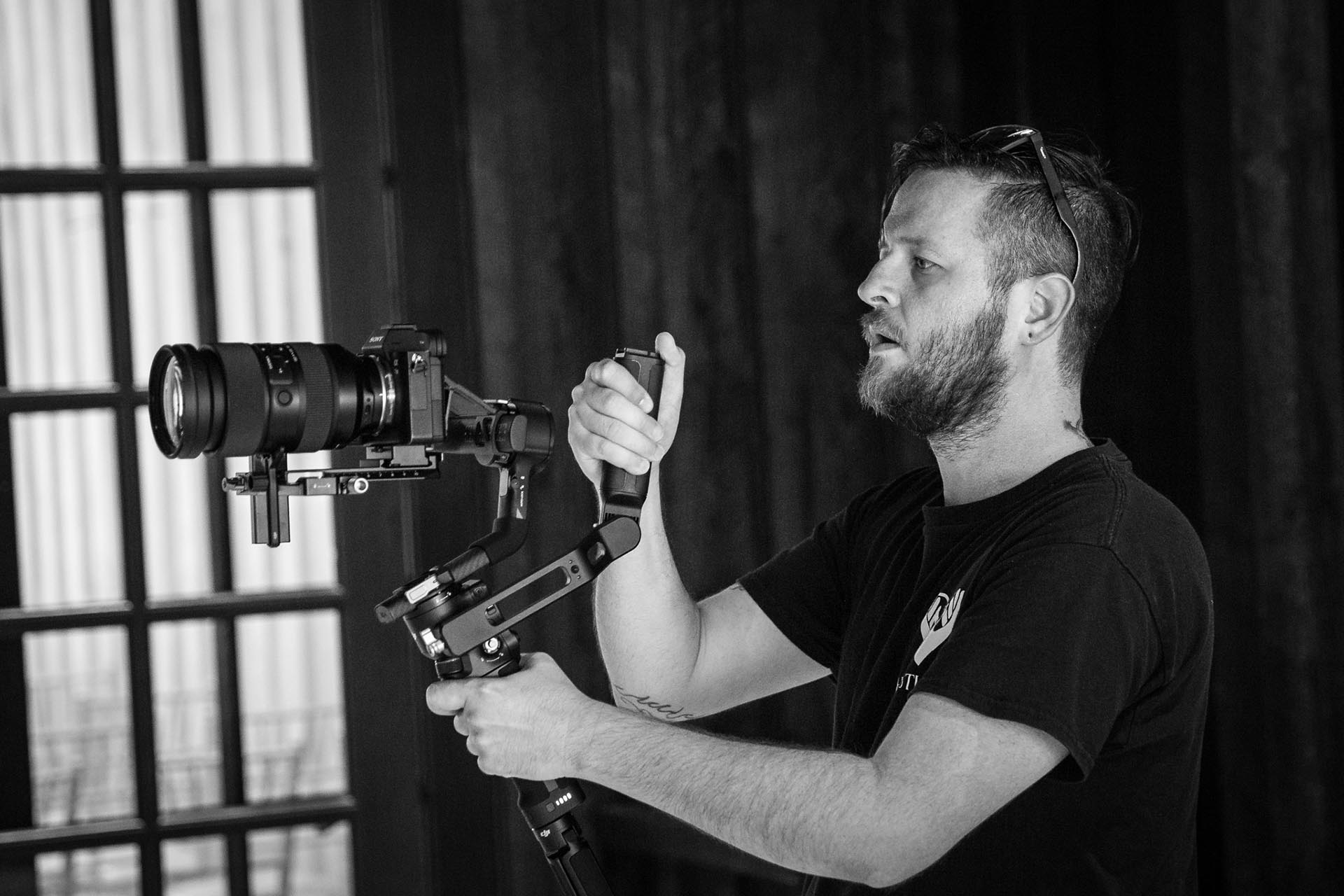 tulsa video production 1 copy Videographer using hand held gimbal and camera to shoot a wedding production in Tulsa