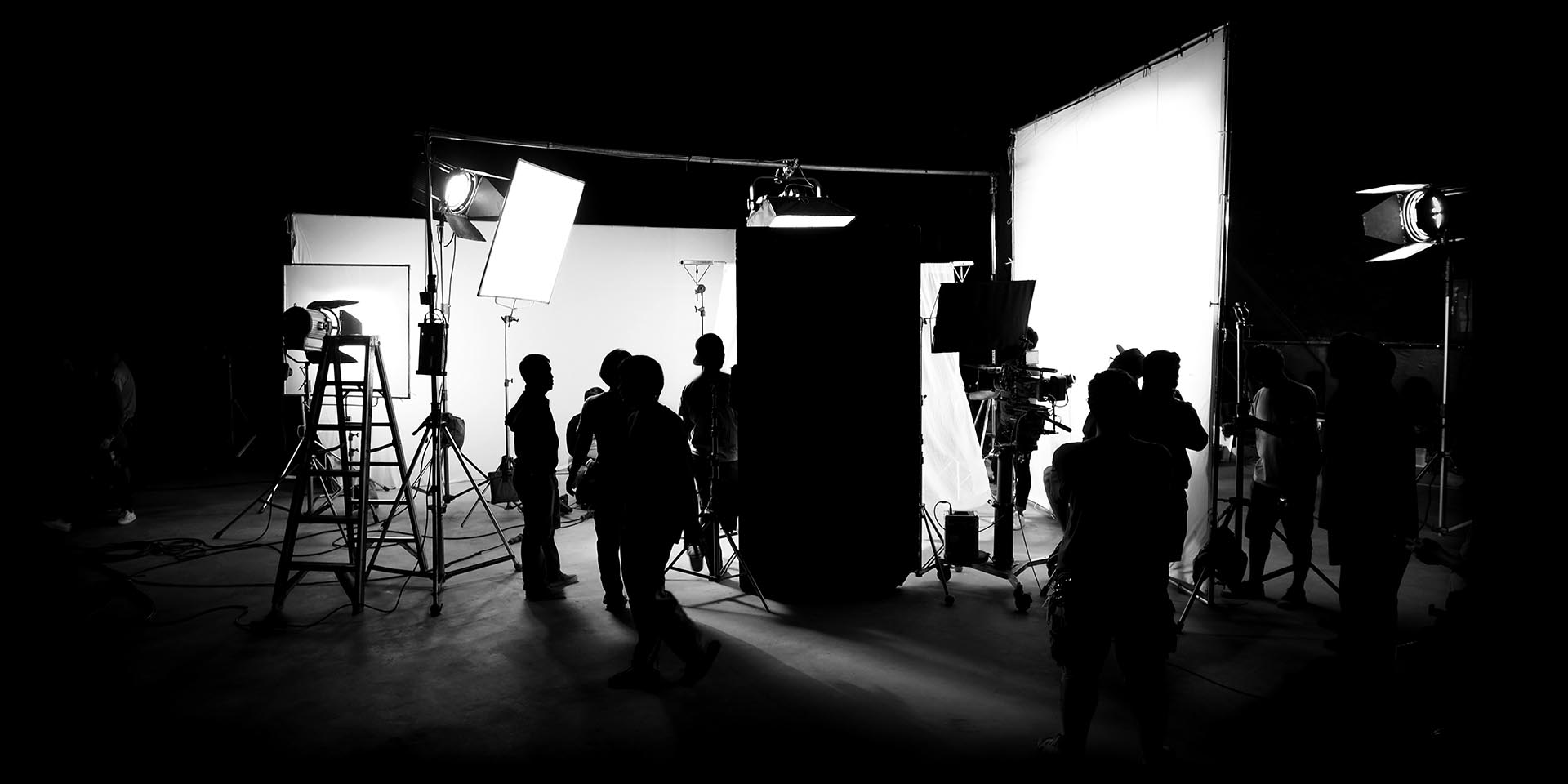 Silhouette images of video production behind the scenes black and white silhouette of a film crew doing a video production in Tulsa